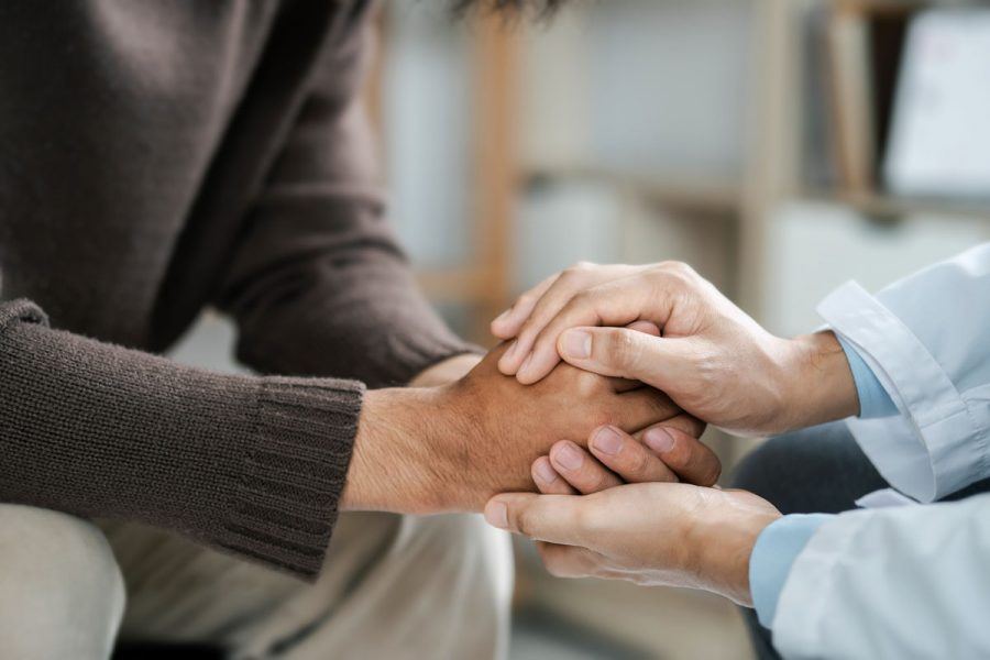 Male doctors shake hands with patients encouraging each other and praying for blessings. To offer love, concern, and encouragement while checking the patient's health. concept of medicine and health care